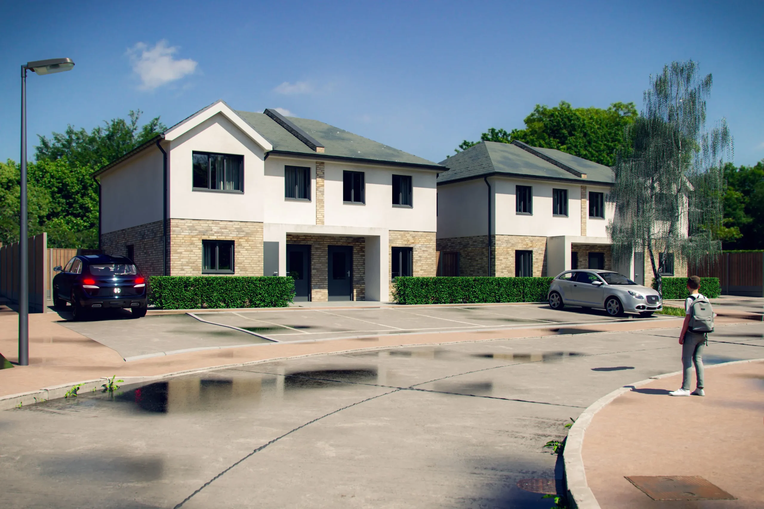 A suburban street in Essex featuring two modern, semi-detached houses designed by an architect, with a party wall between them, a black SUV and silver car parked outside, and a person walking on the sidewalk near a puddle.